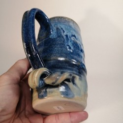 Tall stoneware beer mug, down side view